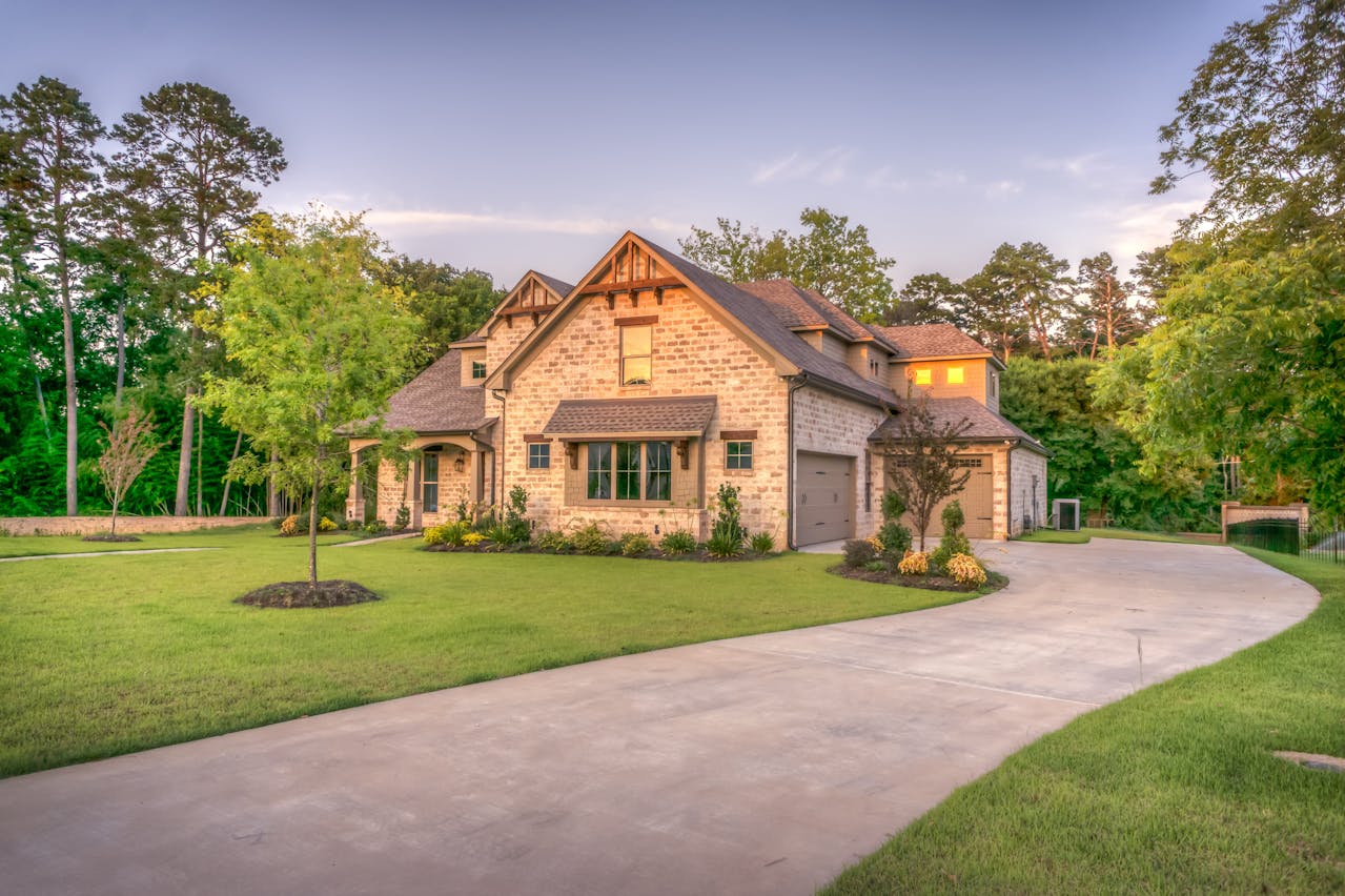 Beautiful home with green lawn at dusk